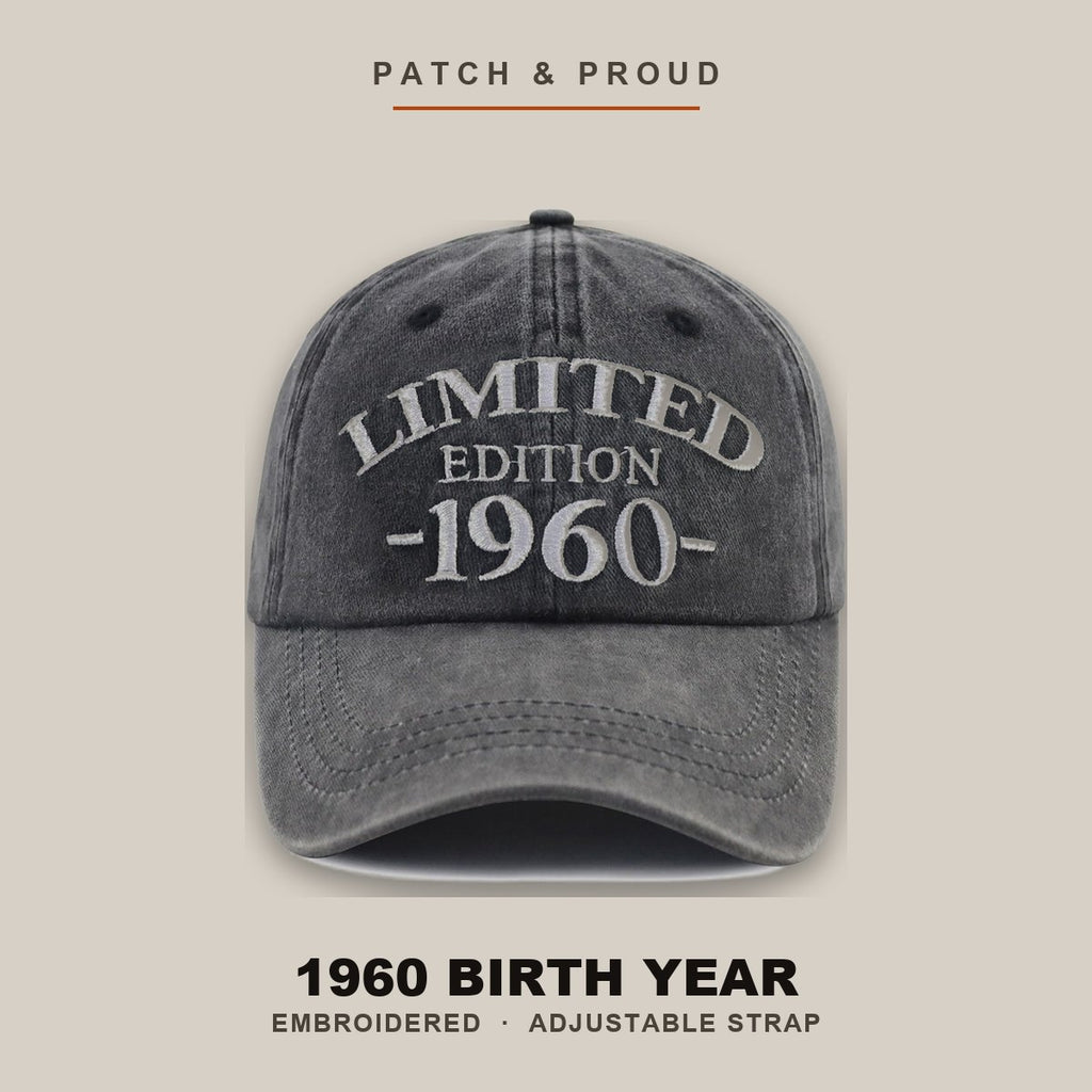 1960 Birth Year Embroidered Cap - Black - shown on a canvas backdrop