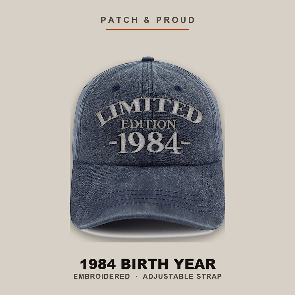 1984 Birth Year Embroidered Cap - Navy - shown on a canvas backdrop