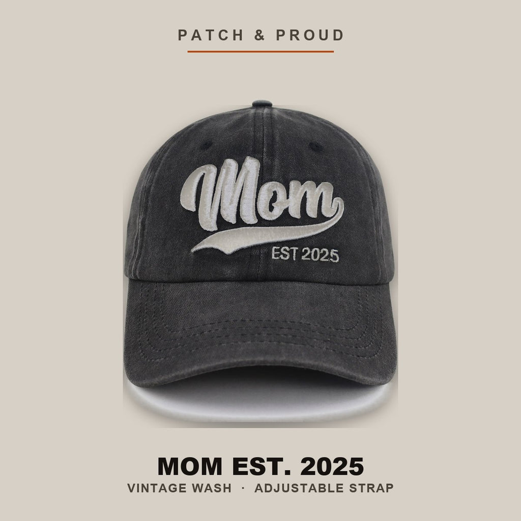 Mom Est. 2025 Vintage Wash Cap - shown on a canvas backdrop