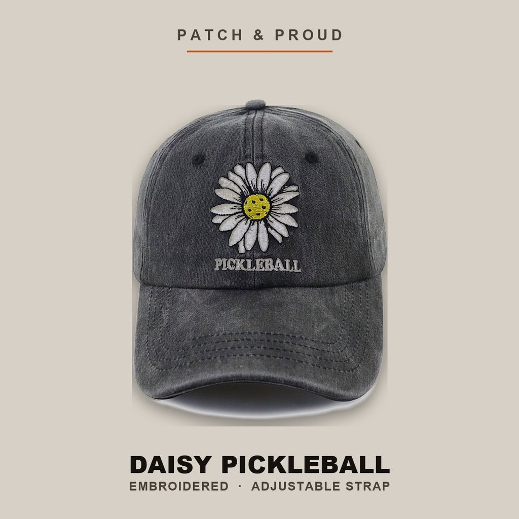 Daisy Pickleball Embroidered Cap - Black - shown on a canvas backdrop