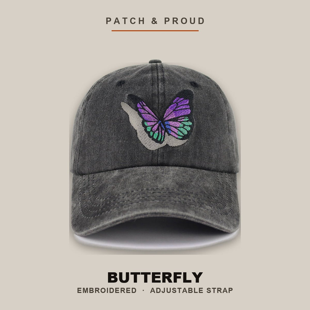 Butterfly Embroidered Cap - shown on a canvas backdrop