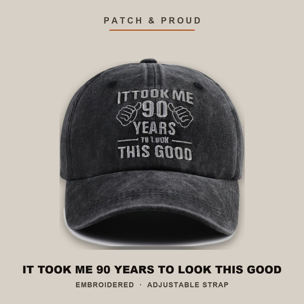 It Took Me 90 Years To Look This Good Cap - shown on a canvas backdrop