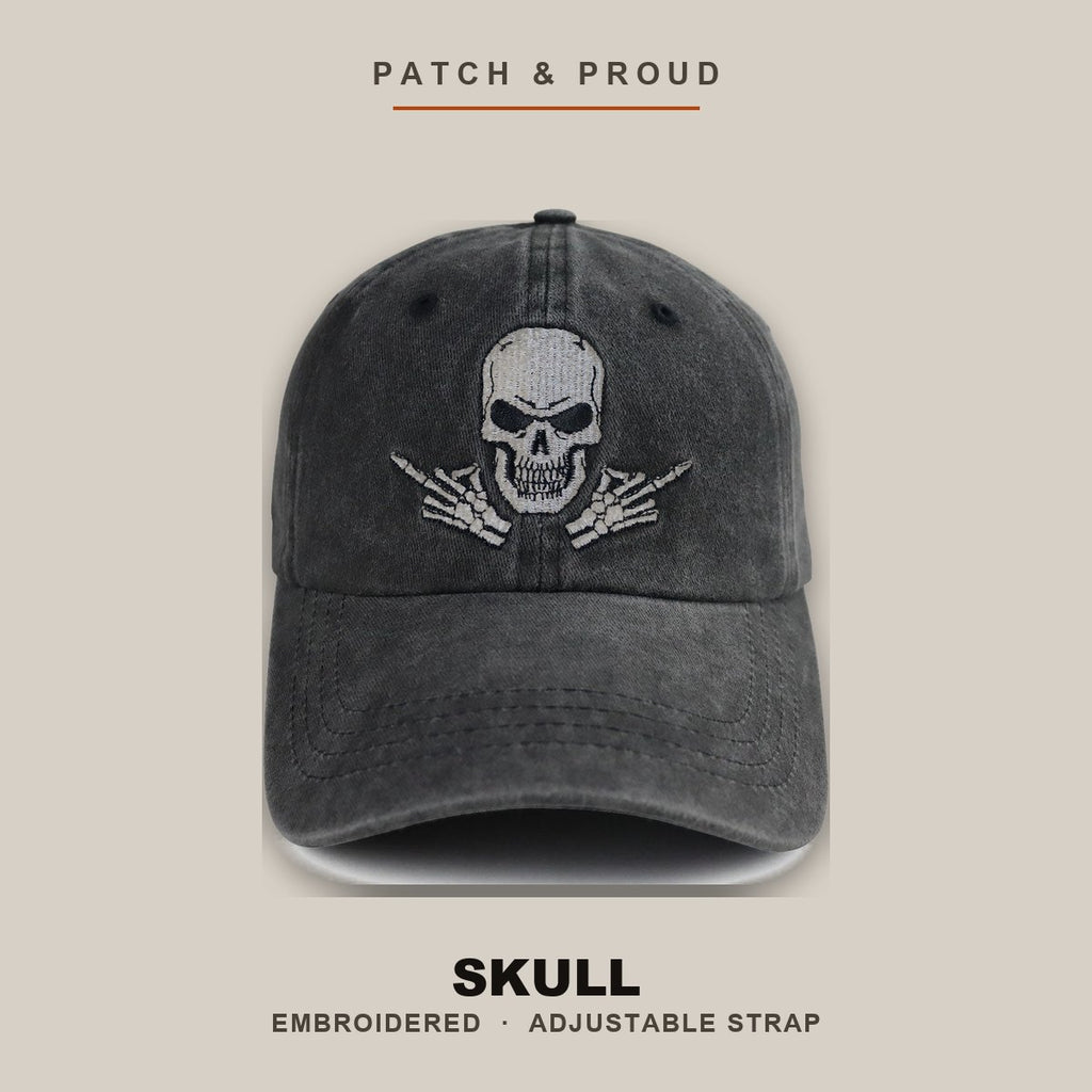 Skull Embroidered Cap - Black - shown on a canvas backdrop